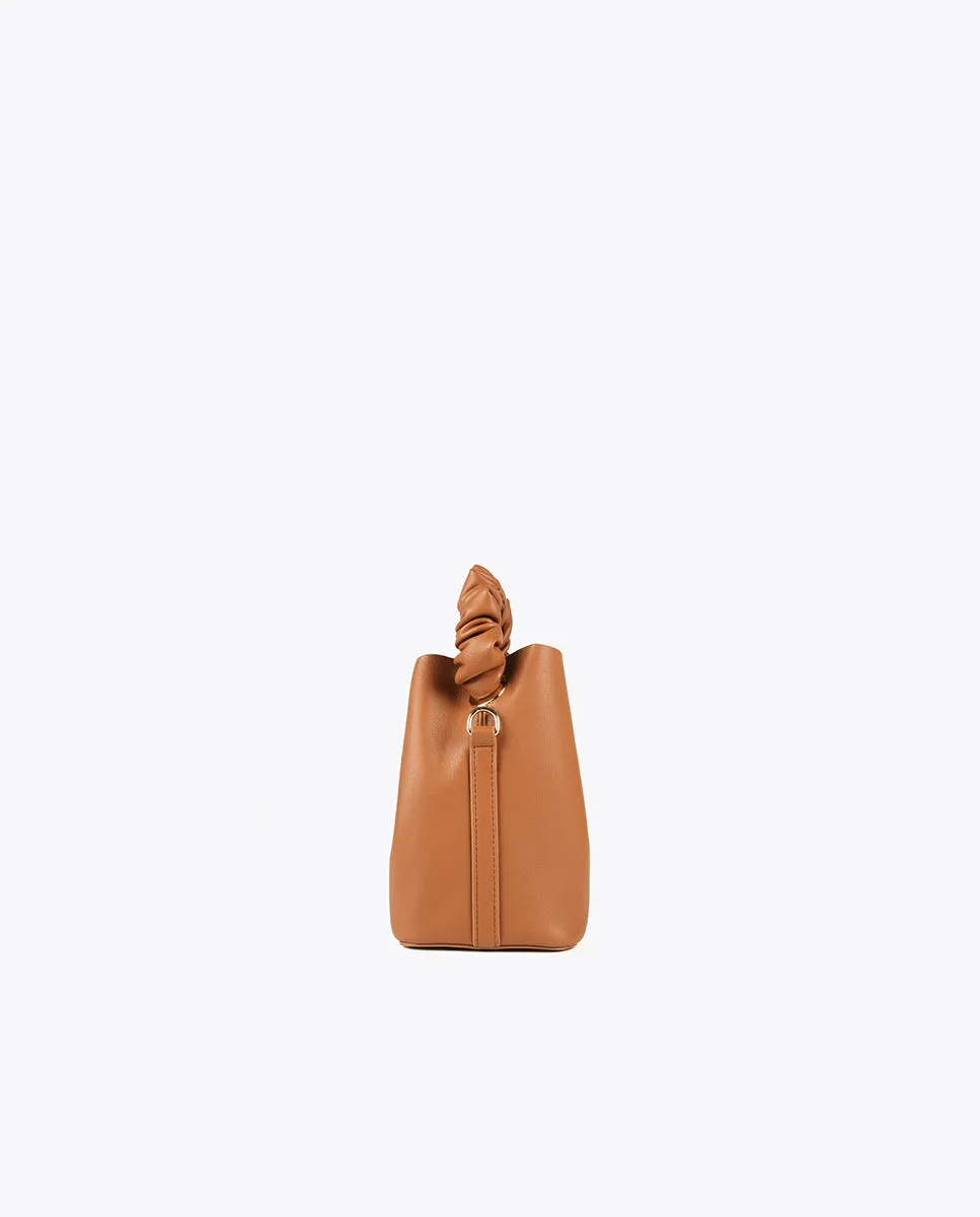 Crossbody bag with gathered strap